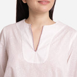 Front Detail of a Model wearing White Hand-Embroidered Cotton Tunic Top