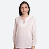 Front View of a Model wearing White Hand-Embroidered Cotton Tunic Top