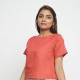 Left View of a Model wearing Brick Red Boat Neck Half Sleeve Cotton Top