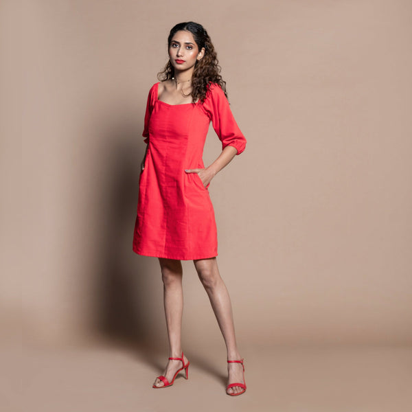 Left View of a Model wearing Red Cotton Velvet Sweetheart Neck Short Paneled Dress