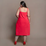 Back View of a Model wearing Red Cotton Velvet Cowl Neck Slip Dress