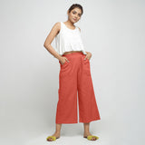 Front View of a Model wearing Red Wide Legged Straight Pant