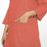 Front Detail of a Model wearing Red Yoked Cotton Tunic Dress