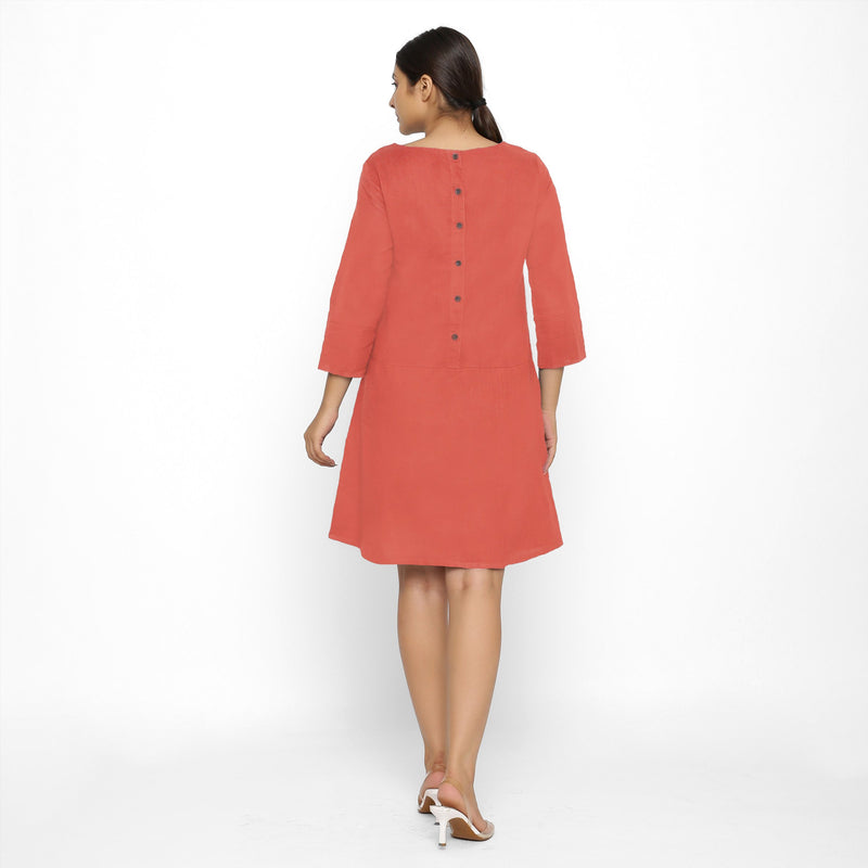 Back View of a Model wearing Red Yoked Cotton Tunic Dress