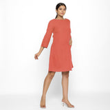 Right View of a Model wearing Red Yoked Cotton Tunic Dress