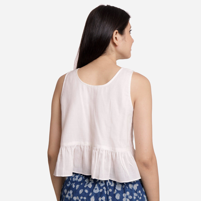 Back View of a Model wearing White Round Neck Cotton Peplum Top