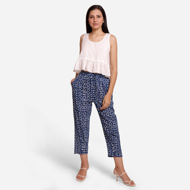 Front View of a Model wearing Flowy White Top and Indigo Pegged Pant Set