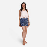 Front View of a Model wearing Relaxed Peplum Top and Indigo Shorts Set