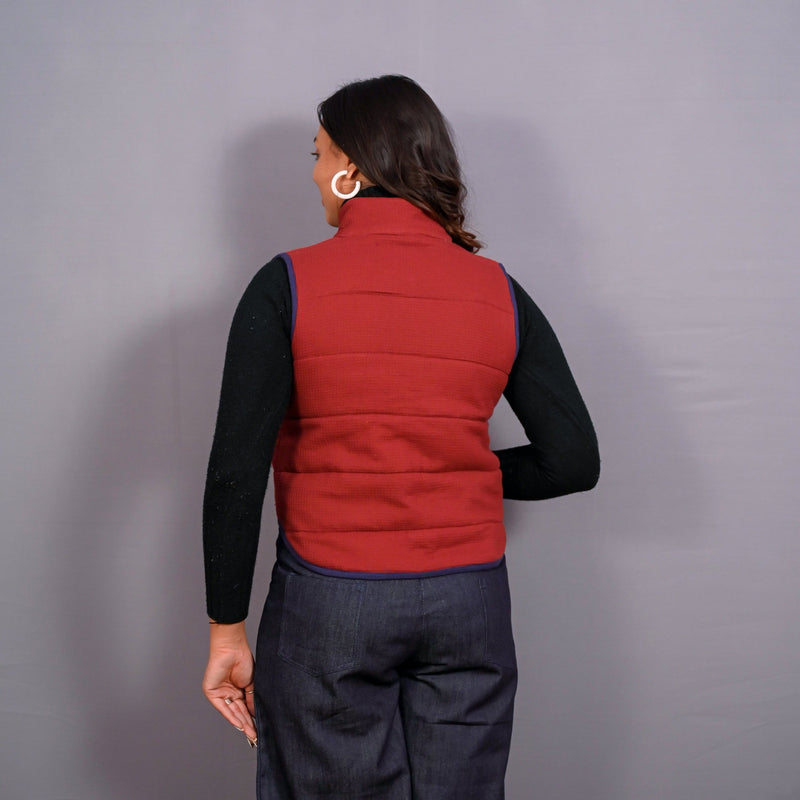 Back View of a Model wearing Reversible Blue and Red Warm Cotton Waffle Sleeveless Quilted Puffer Jacket