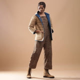 Right View of a Model wearing Blue Reversible Detachable Quilted Cotton Hoodie Jacket