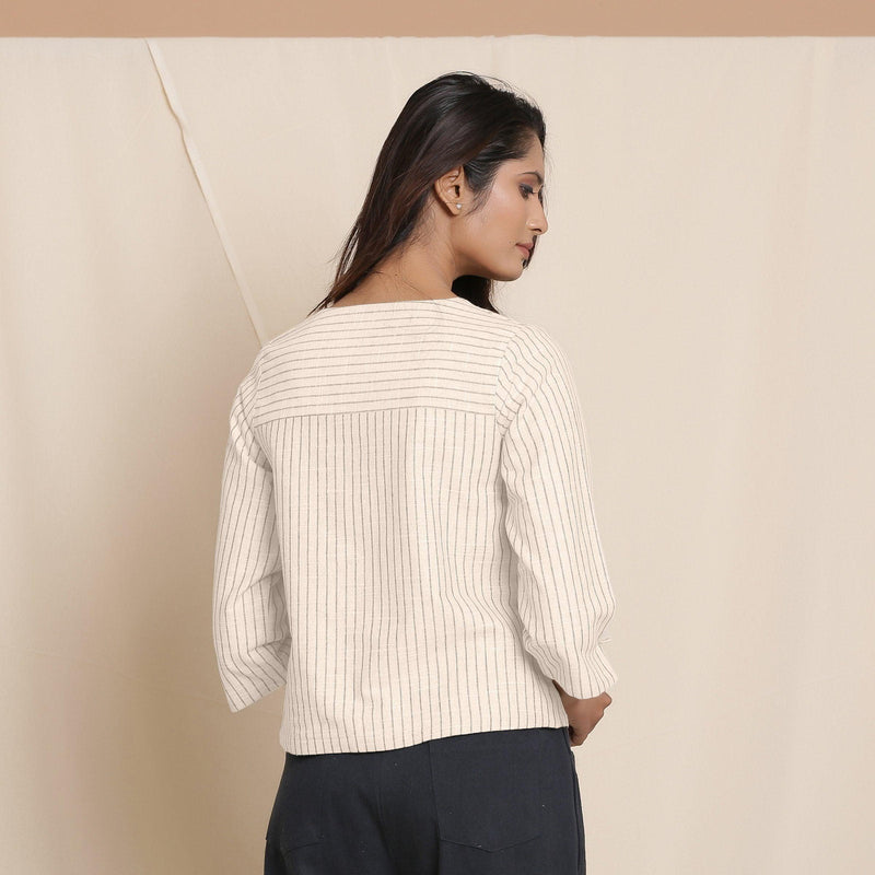 Back View of a Model wearing Reversible Dusk Beige Warm Flannel Button-Down Top