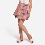 Left View of a Model wearing Reversible Flared Tie Up Mini Skirt