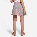Back View of a Model wearing Reversible Flared Tie Up Mini Skirt