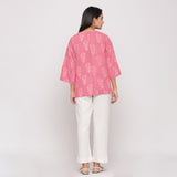 Back View of a Model wearing Reversible Warm Block Printed Pink Short Cotton Overlay