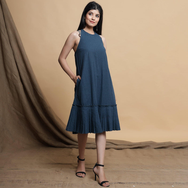 Right View of a Model wearing Reversible Pleated Knee Length Dress