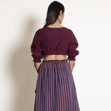 Back View of a Model wearing Reversible Plunge Neck Top and Wrap Skirt Set