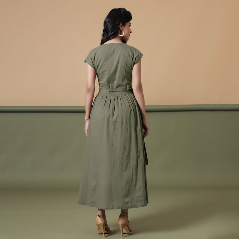 Back View of a Model wearing Reversible Shibori Green Wrap Dress