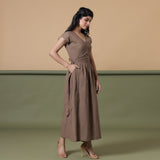 Right View of a Model wearing Reversible Taupe Tie-Dye Cotton V-Neck Maxi Wrap Dress