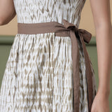 Front Detail of a Model wearing Reversible Taupe Tie-Dye Cotton V-Neck Maxi Wrap Dress