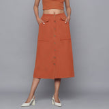 Front View of a Model wearing Sunset Rust Button-Down Midi Skirt