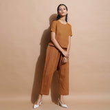 Right View of a Model wearing Rust Cotton Muslin Lined High-Low Top
