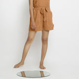 Front View of a Model wearing Rust Vegetable Dyed Handspun Short Shorts