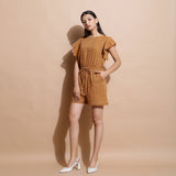 Left View of a Model wearing Rust Handspun Solid Cotton Playsuit