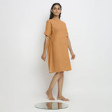 Right View of a Model wearing Rust Handspun Vegetable Dyed Yoked Dress