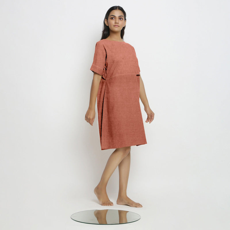 Right View of a Model wearing Rust 100% Linen Yoked Knee Length Shift Dress