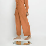 Left View of a Model wearing Rust Patch Pocket Straight Fit Pant
