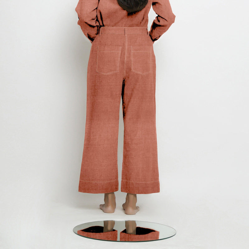 Back View of a Model wearing Rust Sandstone Linen Patch Pocket Wide Legged Pant