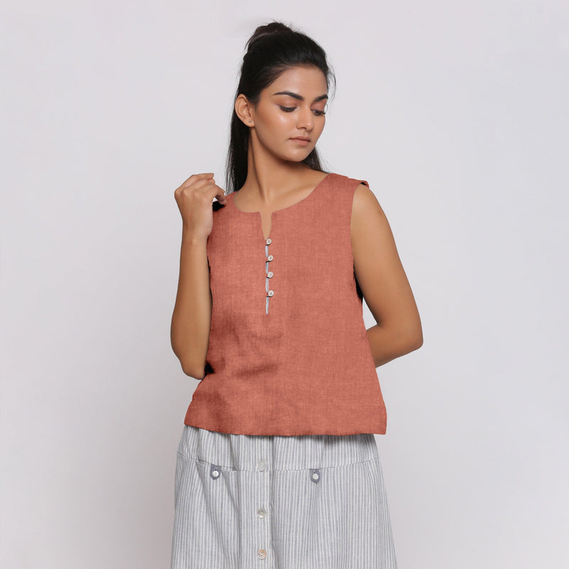 Front View of a Model wearing Rust Sandstone Linen Split Neck Button-Down Sleeveless Top