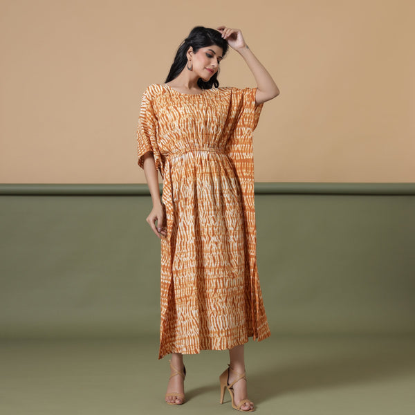 Front View of a Model wearing Rust Sandstone Shibori Tie-Dye Cotton Midi Kaftan Dress