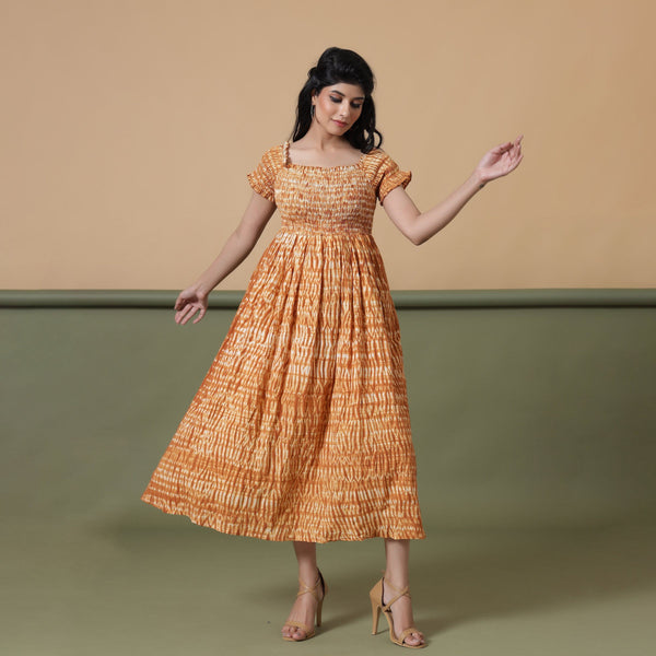 Front View of a Model wearing Rust Shibori Elasticated Gathered Dress