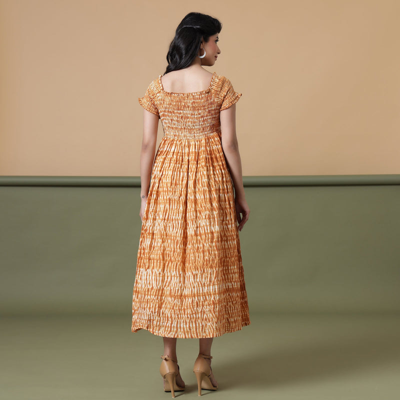 Back View of a Model wearing Rust Shibori Elasticated Gathered Dress