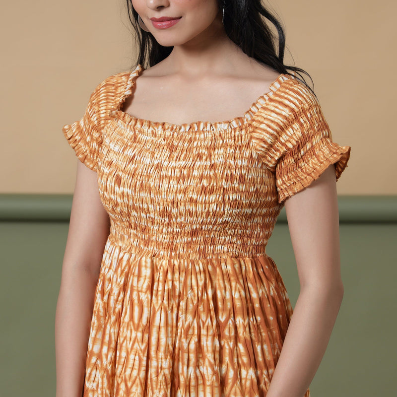 Front Detail of a Model wearing Rust Shibori Elasticated Gathered Dress