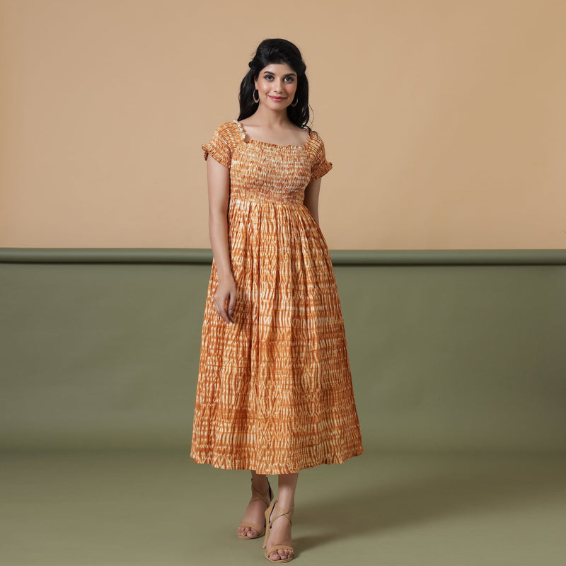 Front View of a Model wearing Rust Shibori Elasticated Gathered Dress