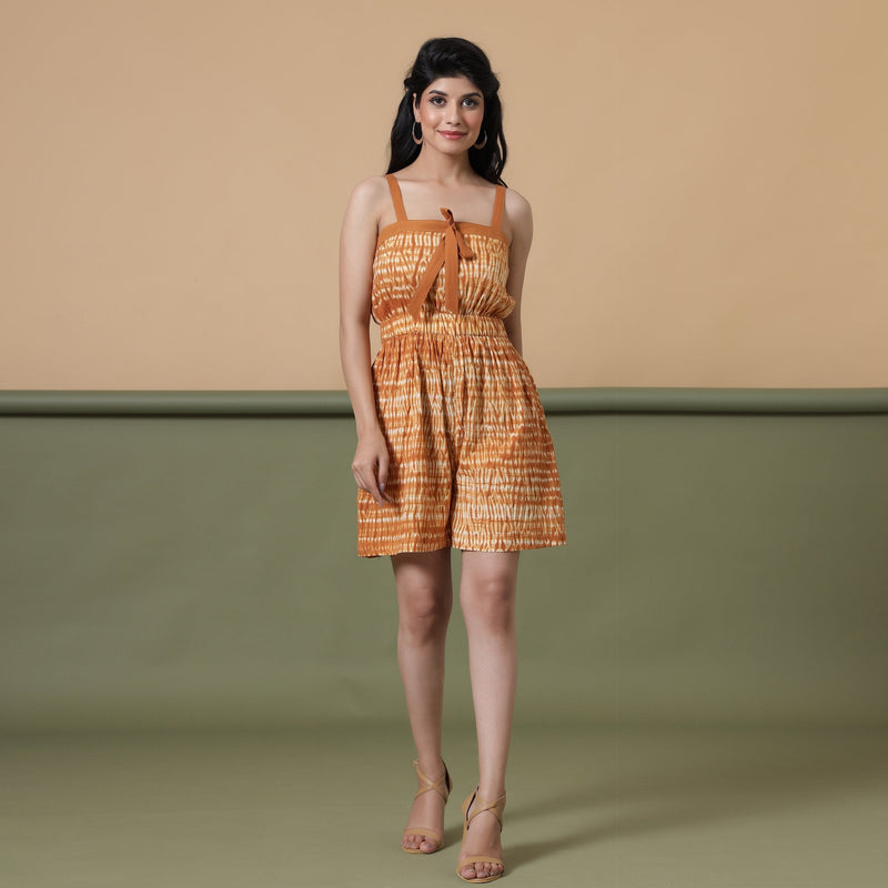 Front View of a Model wearing Rust Shibori Tie-Dye Cotton Strap Sleeve Gathered Romper