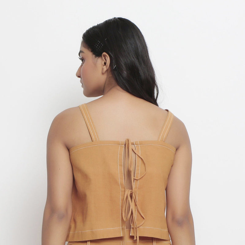 Back View of a Model wearing Rust Handspun Cotton Spaghetti Top