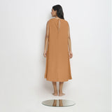 Back View of a Model wearing Rust Vegetable Dyed A-Line Paneled Dress