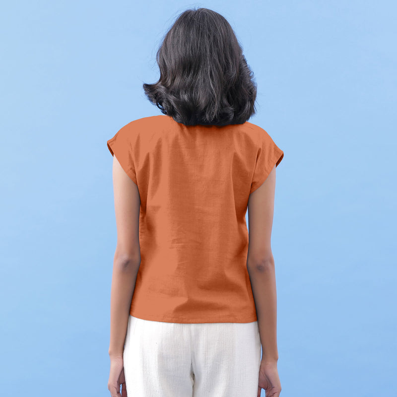 Back View of a Model wearing Rust Vegetable Dyed Handspun Cotton Essential Top