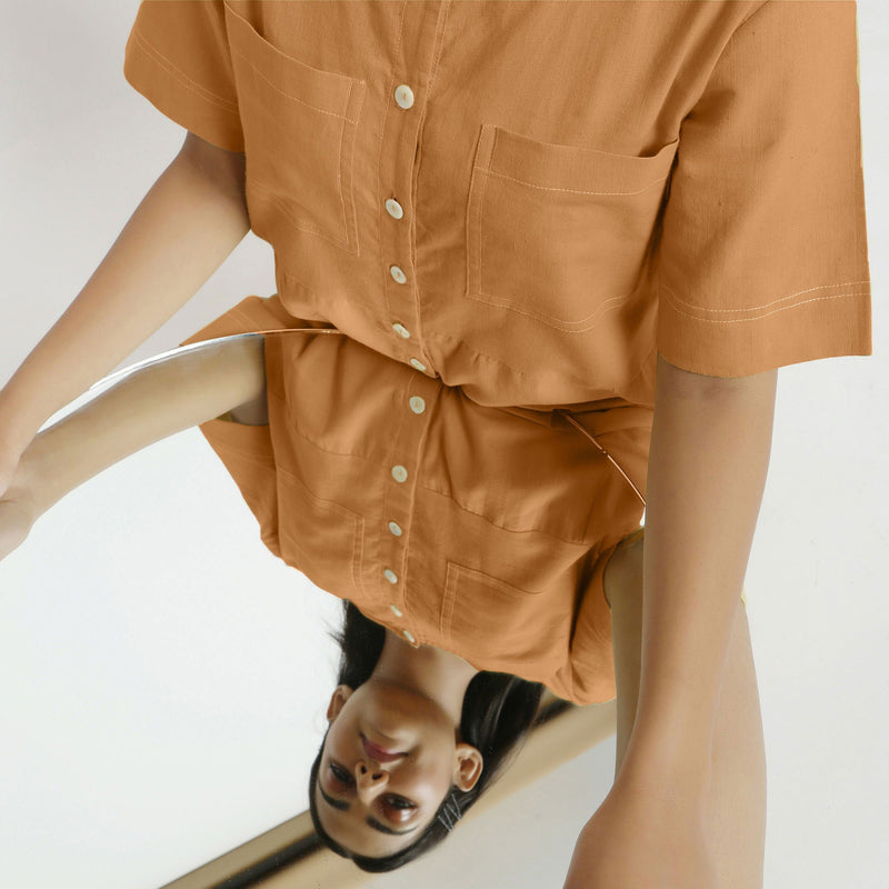 Front Detail of a Model wearing Rust Vegetable Dyed Romper