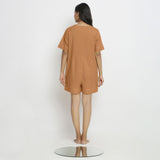 Back View of a Model wearing Rust Vegetable Dyed Romper
