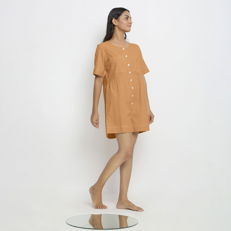 Right View of a Model wearing Rust Vegetable Dyed Romper