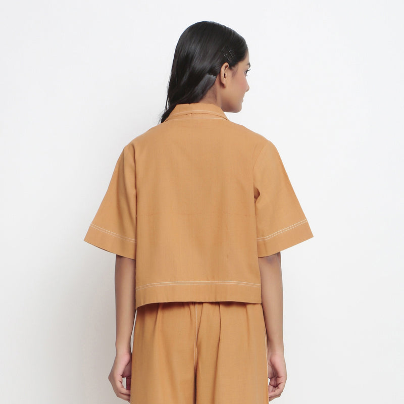Back View of a Model wearing Rust Vegetable Dyed Solid Handspun Shirt