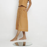 Left View of a Model wearing Rustic Vegetable Dyed Cotton Button-Down Midi Skirt