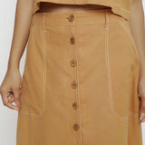 Front Detail of a Model wearing Rustic Vegetable Dyed Cotton Button-Down Midi Skirt