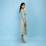 Right View of a Model wearing Sage Green Cotton Block Printed Blouson Dress