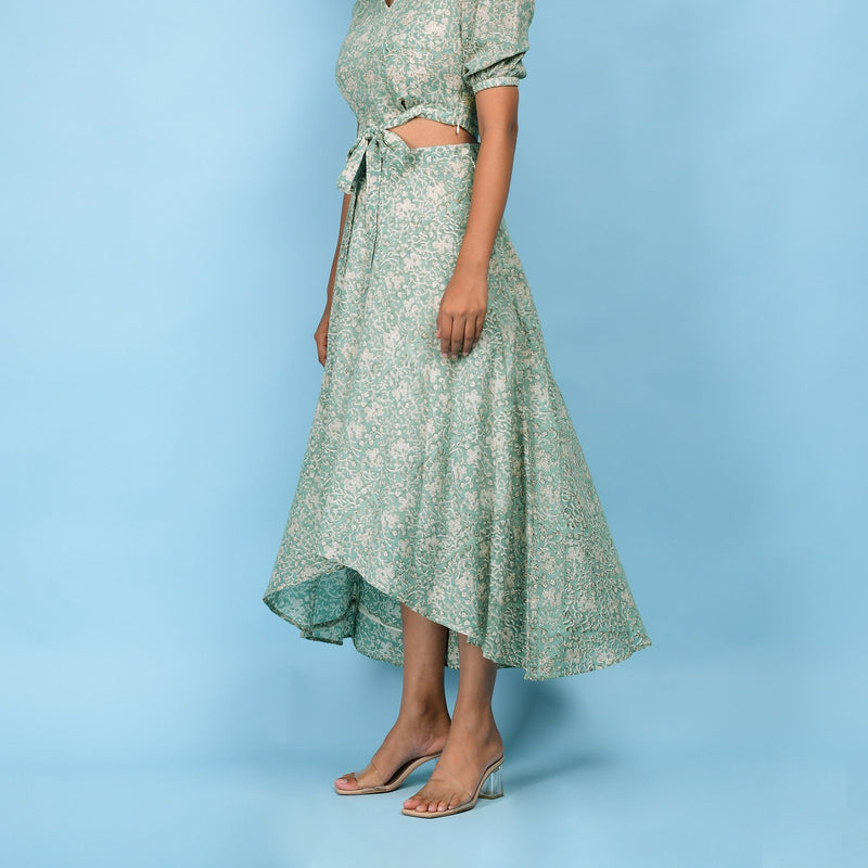 Left View of a Model wearing Sage Green Block Printed 100% Cotton High-Low Circular Skirt