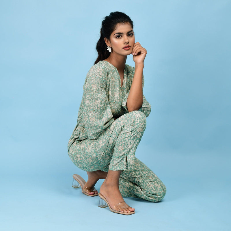 Right View of a Model wearing Sage Green Block Printed 100% Cotton Straight Jumpsuit